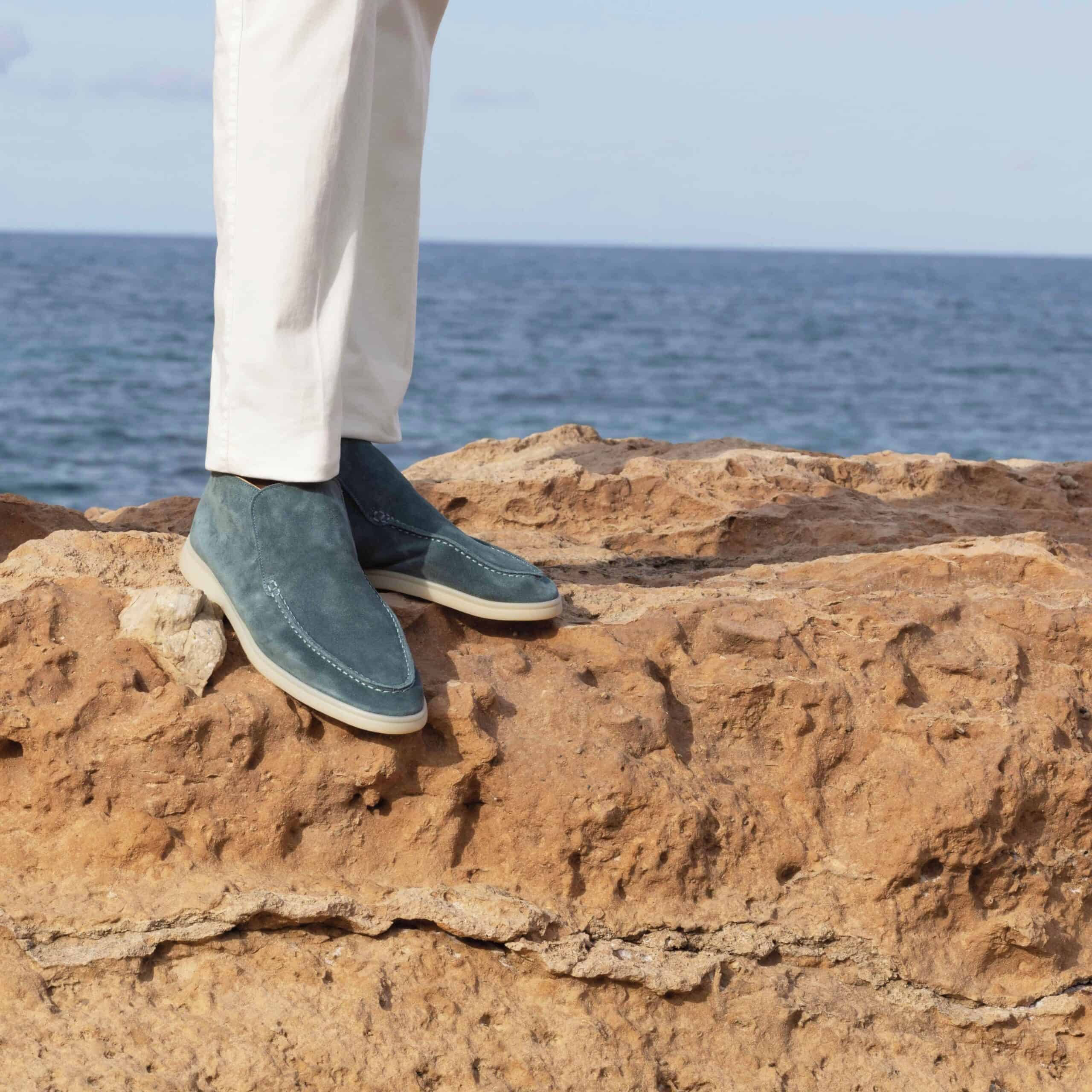 wearing a pair of city loafers by aurelien on a rocky surface